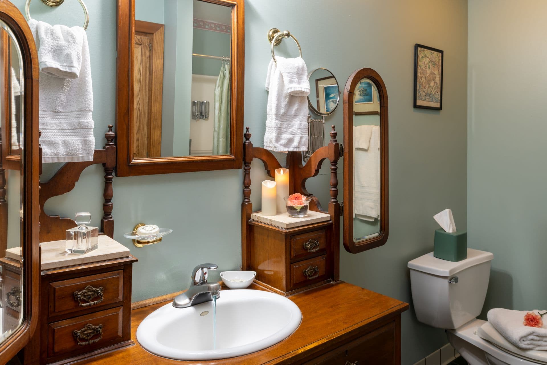 Bathroom with antique oak vanity sink with mirror.